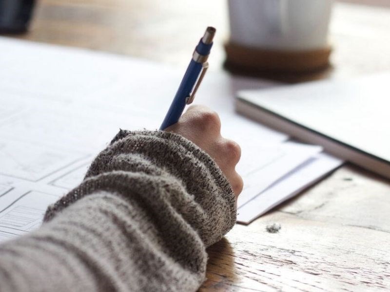 Student writing his notes