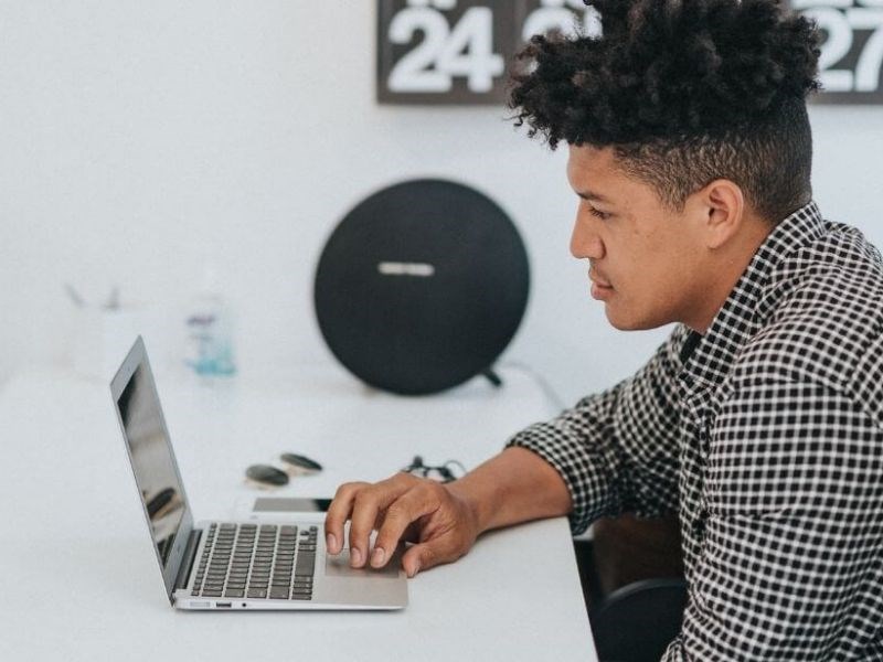 Student checking his Laptop