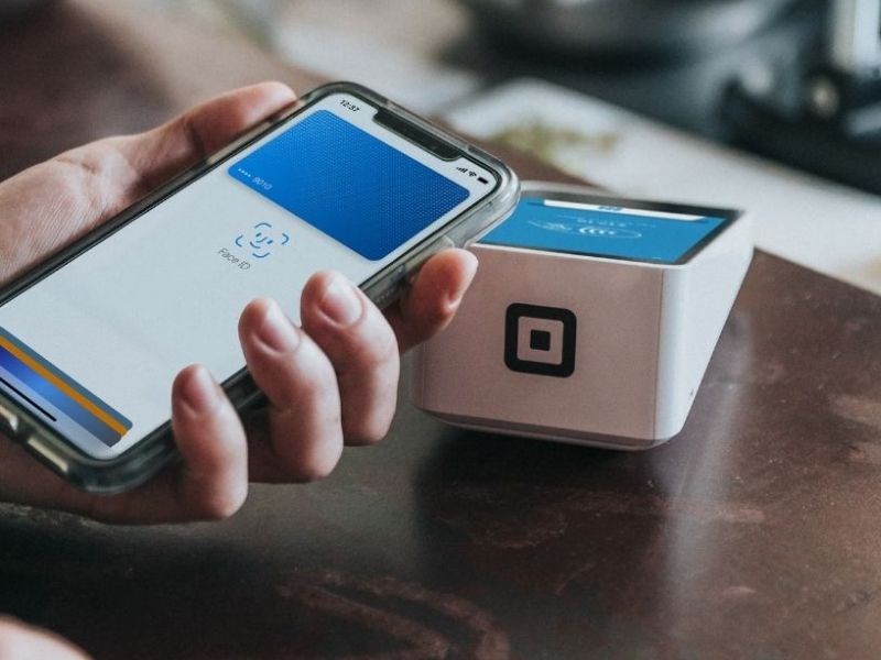 customer holding a mobile phone in his hand with QR code scanning